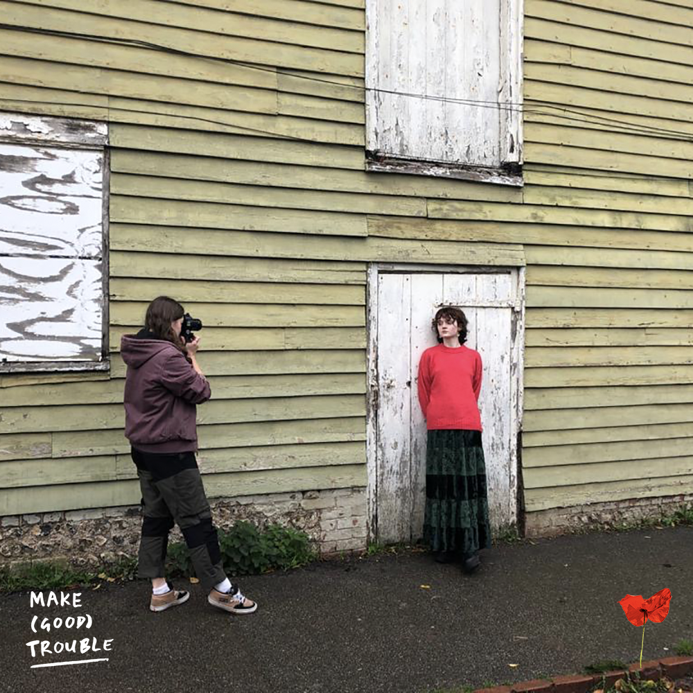 Photographer and model outside barn