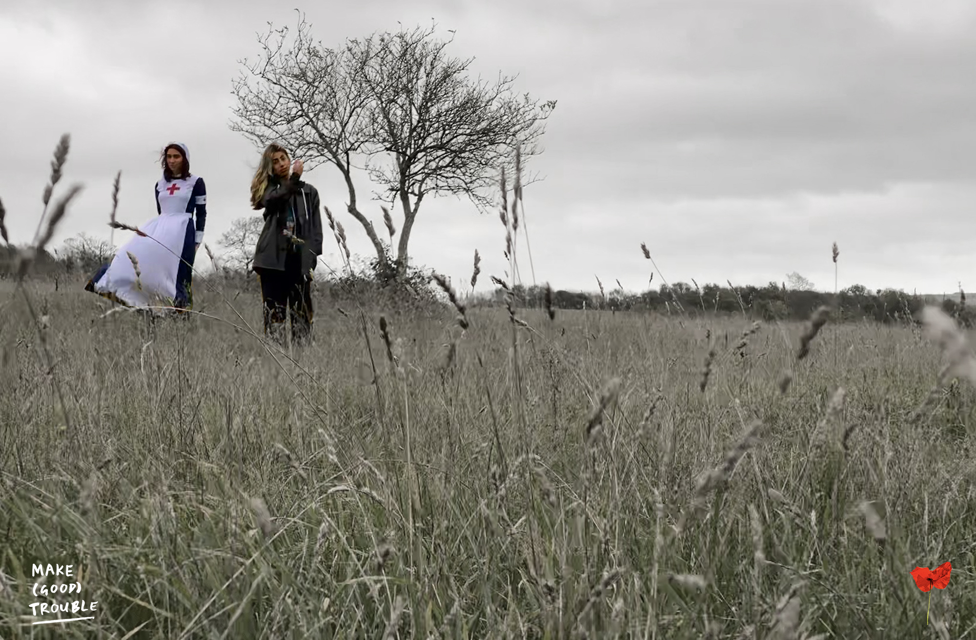 Girls in WW1 and modern dress on hill